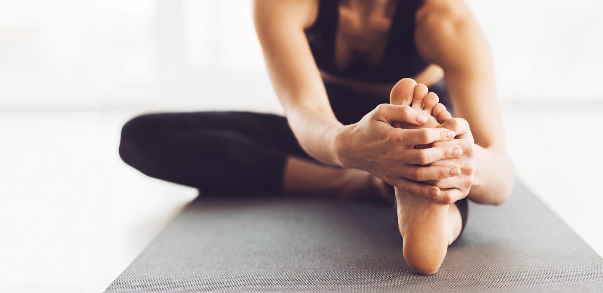 Woman Practicing Morning Yoga Stretch Routine Indoors